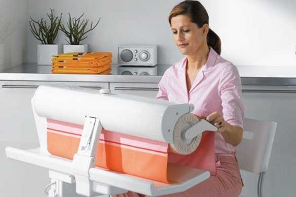 Гладильная машина – полезная техника для дома